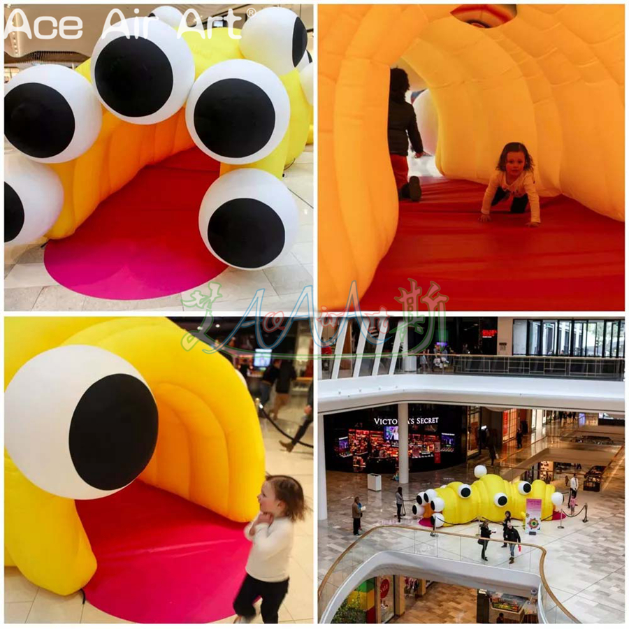 Yellow Inflatable Caterpillar Tunnel Tent Children's Entertainment Curved Marquee with 2 Entrance and Many Eyes for Mall Display