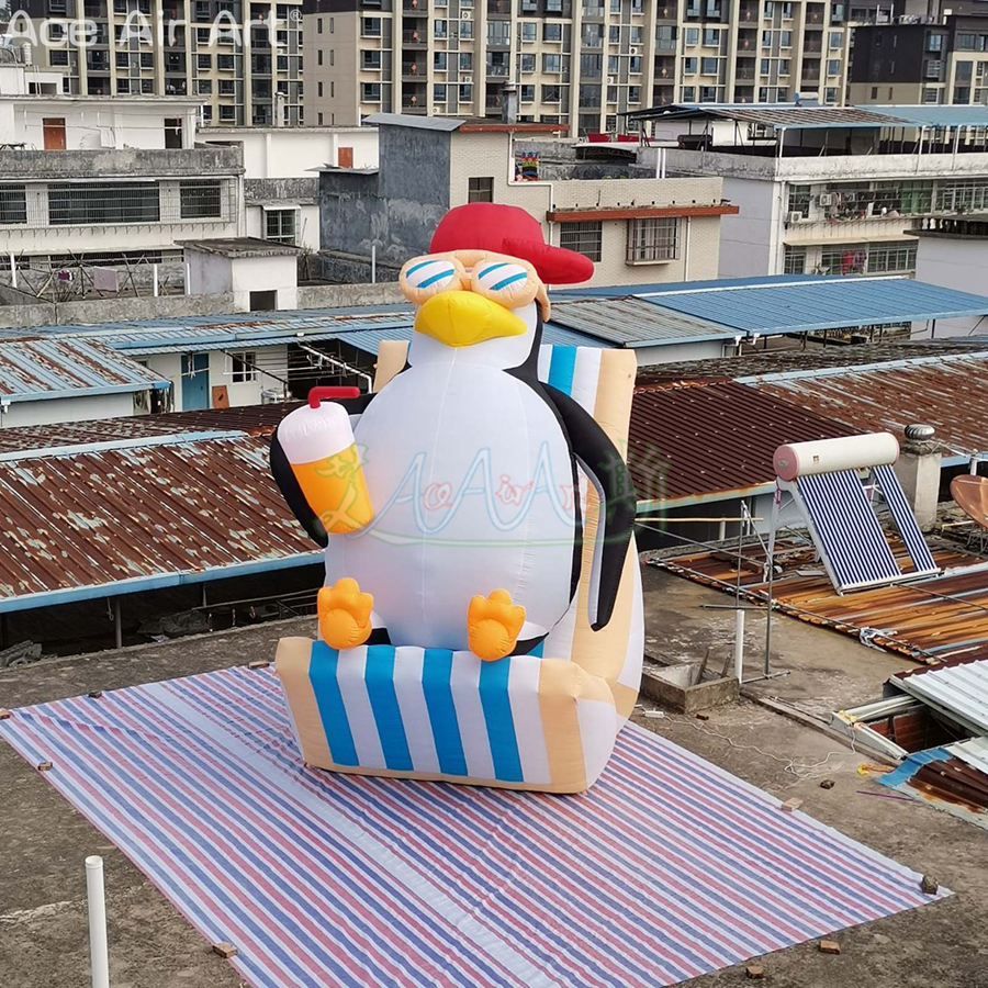 Customized 4.5m H Inflatable Handheld Juice Cup Penguin with Red Cap Cute Beach Penguin Wearing Sunglasses for Business Events